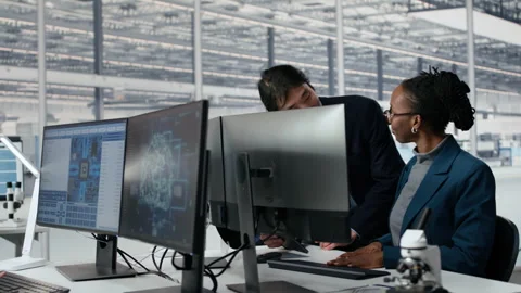 Senior manager and woman using AI to optimize microchip production Video stock 335881283