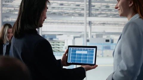 Senior manager doing microchips yield enhancement with worker using tablet Stock Footage 335880620