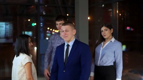 Senior Manager with his subordinates successfully finished the working day Stock Footage 100003966