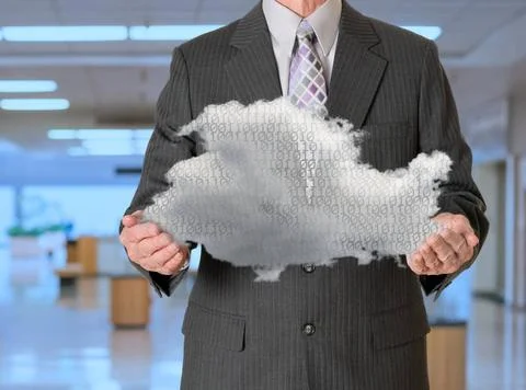 Senior manager holding cloud computing Senior male caucasian executive hol... Stock Photos