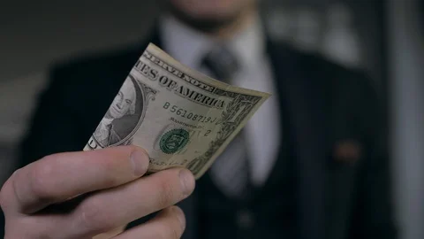 A senior manager issues a salary to an office worker Stock Footage 89366796