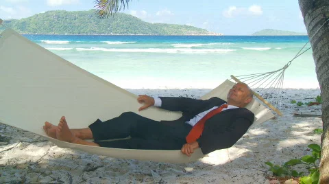 Senior manager napping in hammock Stock Footage 133099