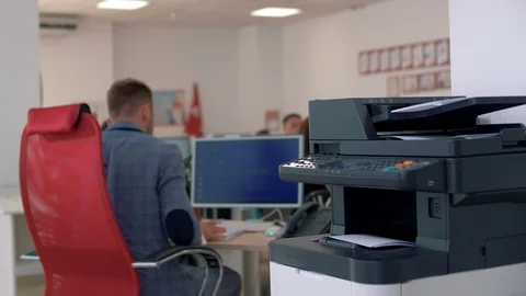 Senior manager sits at the workplace in the office Stock Footage 128583362