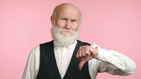 Senior Man's Changing Gesture from Approval to Disapproval Stock Footage 262626706