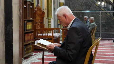 Senior men read Quran inside Ibrahimi Mosque, Hebron Video stock 168784696
