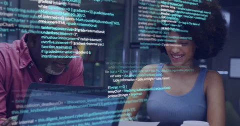 Senior mentor reviewing scrolling JavaScript code while junior developer writing Stock Footage 314085125