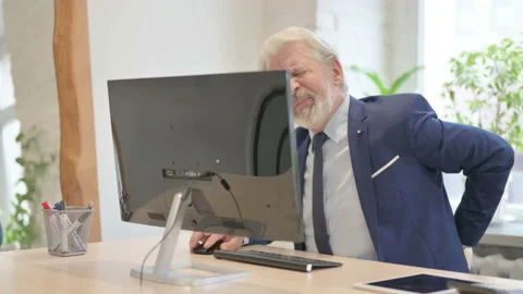 Senior Old Businessman having Back Pain while Working on Computer Stock Footage 221227722
