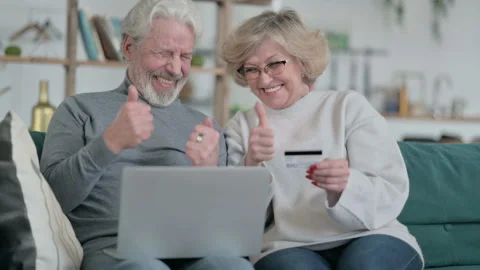 Senior Old Couple doing Successful Online Shopping on Laptop Stock Footage 148202623
