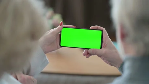 Senior Old Couple using Smartphone with Green Chroma Key Screen Video stock 148199957