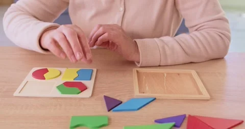 Senior old elderly female deduction to solve logic game, playing for developing Stock Footage 328101025
