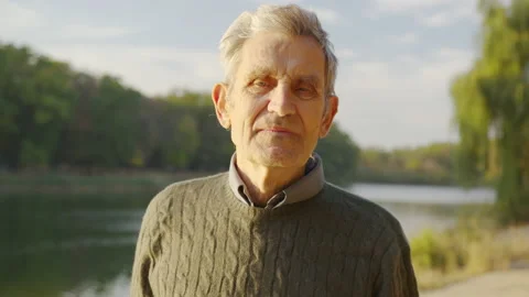 Senior old gray-haired man looking at camera, serious happy elder mature Stock Footage 141646713