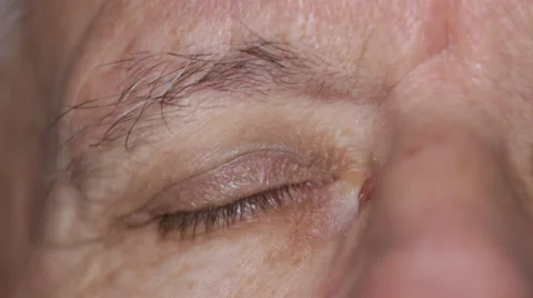 Senior opening eye Stock Footage 34216802