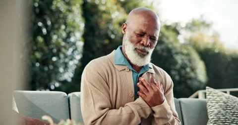 Senior, outdoor or black man with chest pain for cardiac arrest, heart attack or Stock Footage 341663159