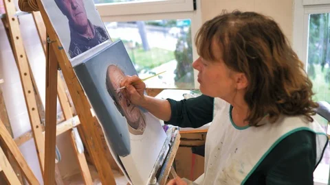 Senior painter making realistic portrait Stock Footage 124366547