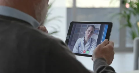 Senior patient having a video chat consultation with his doctor Stock Footage 157545585