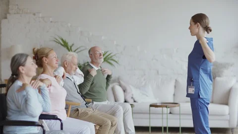 Senior patients doing exercise in nursing home Stock Footage 117524974