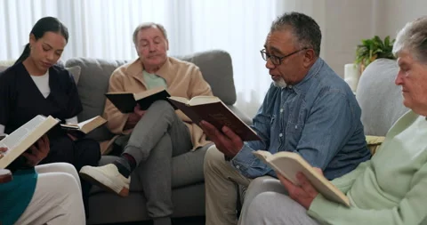 Senior people, bible study and reading in lounge with pastor, friends or family Stock Footage 247770525