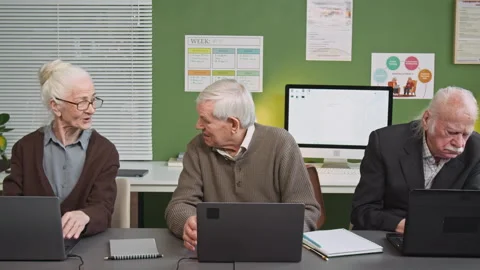 Senior People Chatting and Using Laptops in Computer Literacy Class Stock Footage 333710584