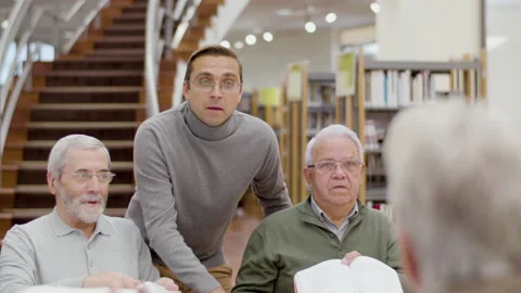 Senior people having debate during class in library Stock-Footage 232622831