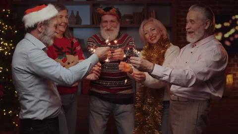 Senior People Having Fun Together, Holding Sparkles and Dancing in the Living Video stock 253658870