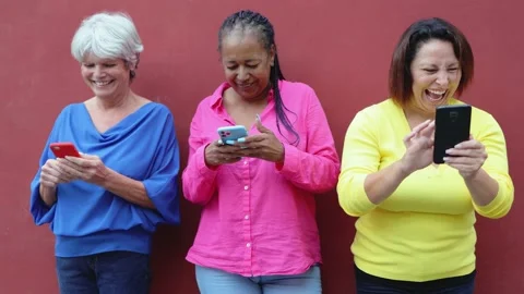 Senior people having fun using mobile phones outdoor - Elderly, technology Stock Footage 163373972