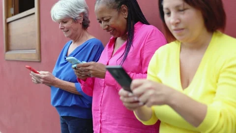 Senior people having fun using mobile phones outdoor - Elderly, technology Stock Footage 163374268