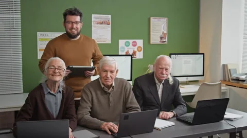 Senior People Posing with Teacher in Computer Literacy Class Stock Footage 333710817