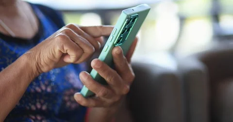 Senior person using a smartphone and tapping the screen. digital technology.. Stock Footage 339384972