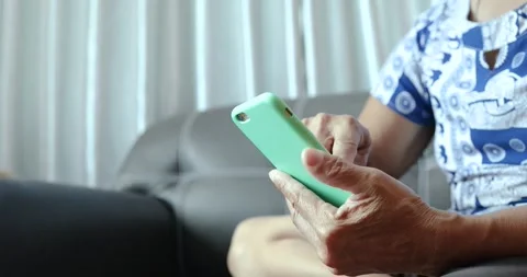Senior person using a smartphone and tapping the screen. digital technology.. Stock Footage 339881595