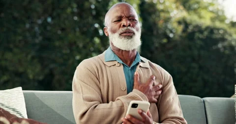 Senior, phone or black man with chest pain for heart attack, cardiac arrest or Stock Footage 341663084