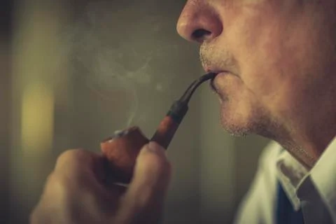 Senior pipe smoker Stock Photos
