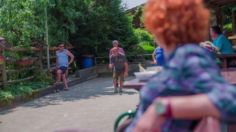 Senior player playing boule game Stock Footage 54370209