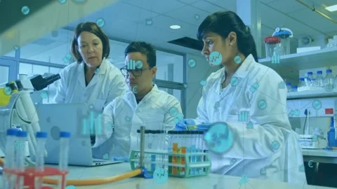 Senior pointing at laptop while lab tech toggling causing blue overlays, pipette Stock Footage 328307046