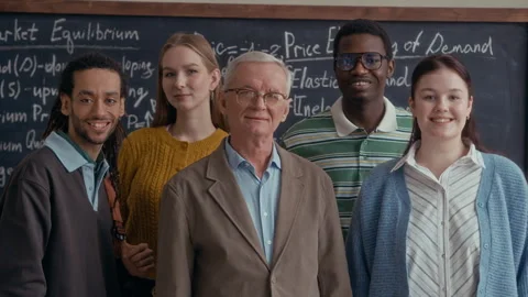 Senior Professor with Diverse Students in Classroom Portrait Stock Footage 332291008