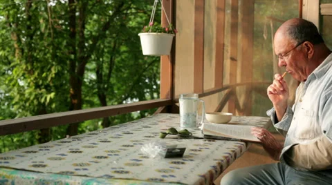 Senior reading book Stock-Footage 34405085