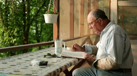 Senior reading book Video stock 34596462