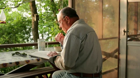 Senior reading book Video stock 34596869