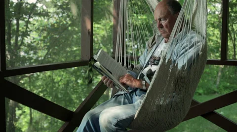 Senior reading book Video stock 34695085