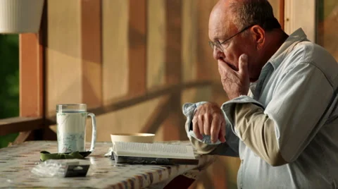 Senior reading book Video stock 34695262