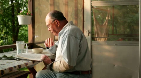 Senior reading book Video stock 34758218