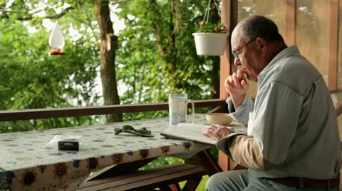 Senior reading book Video stock 34759286