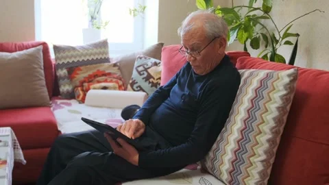 Senior Reading Relax, Older Man Enjoys Leisurely Book Time, Elderly Gentleman U Stock Footage 326864297