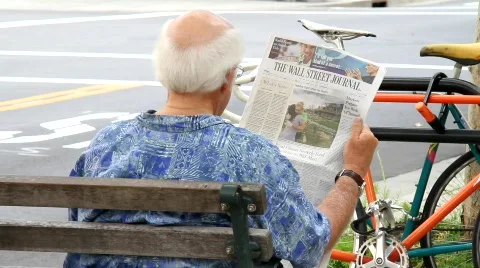 Senior reads newspaper Stock Footage 734778