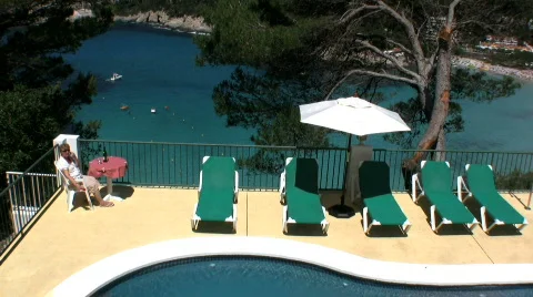 Senior relaxing at a Villa in the sun  Stock Footage 753779