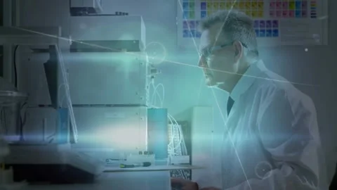 Senior researcher inserting vial into lab analyzer, starting analysis and typing Stock Footage 331213983