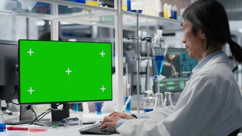 Senior researcher using green screen computer program in laboratory Stock Footage 320143820