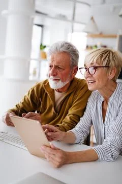 Senior retired couple learn about computer and online support. 스톡 사진