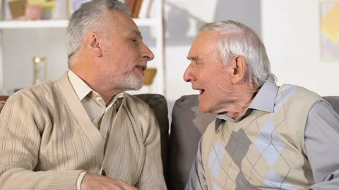 Senior retired man with hearing problem listening to friend, communication Stock Footage 108093937