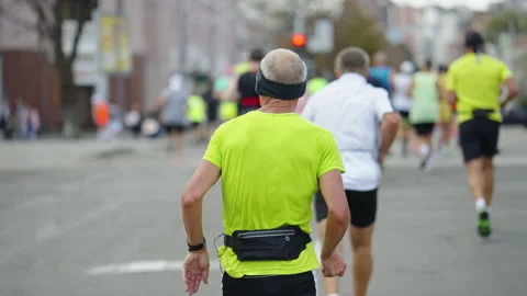 Senior runner taking part in marathon Stock-Footage 162468875