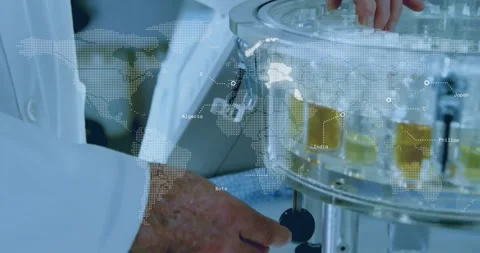 Senior scientist adjusting analyzer carousel in laboratory, featuring dotted Stock Footage 325966144